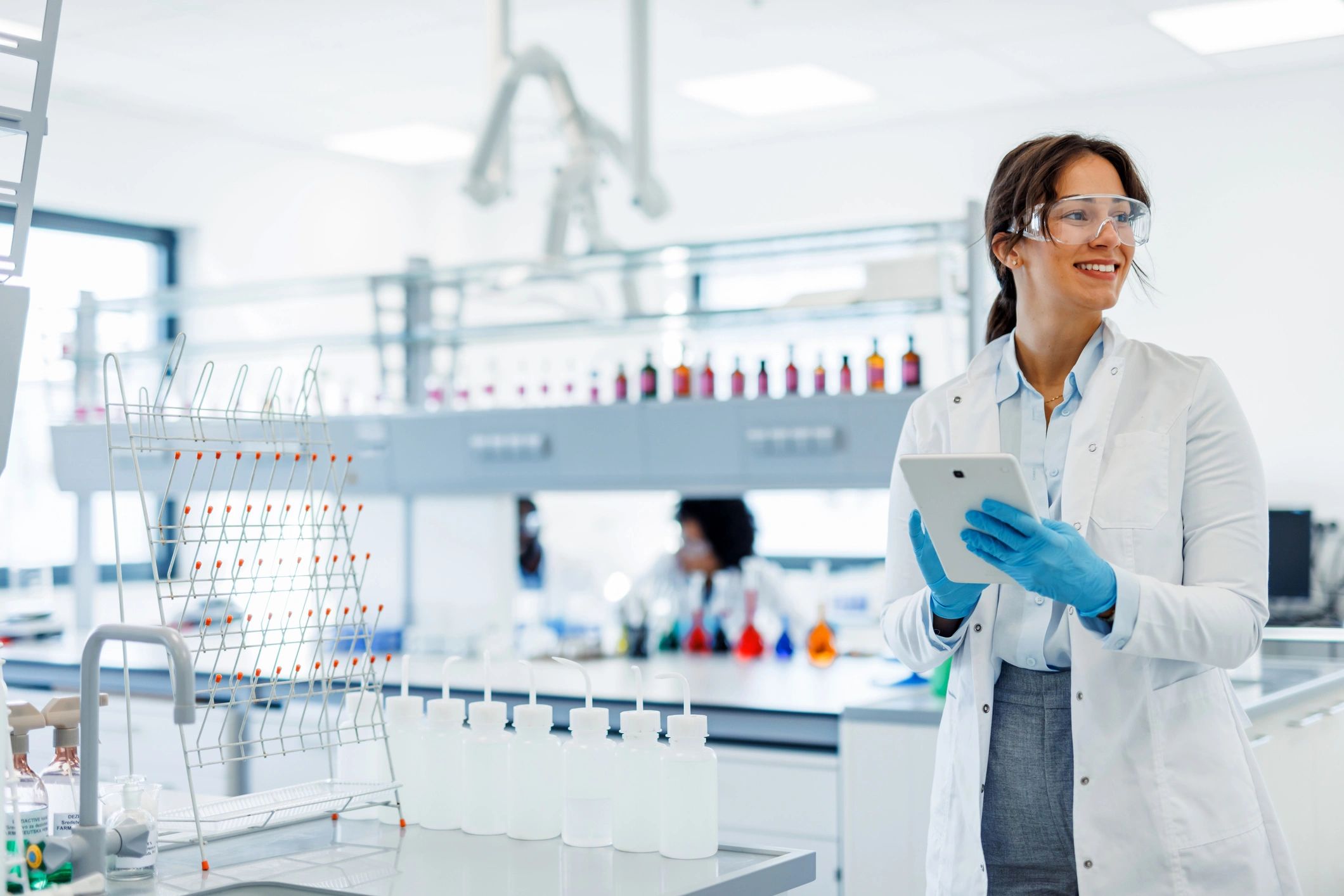 Scientist reviewing quality documentation on a tablet