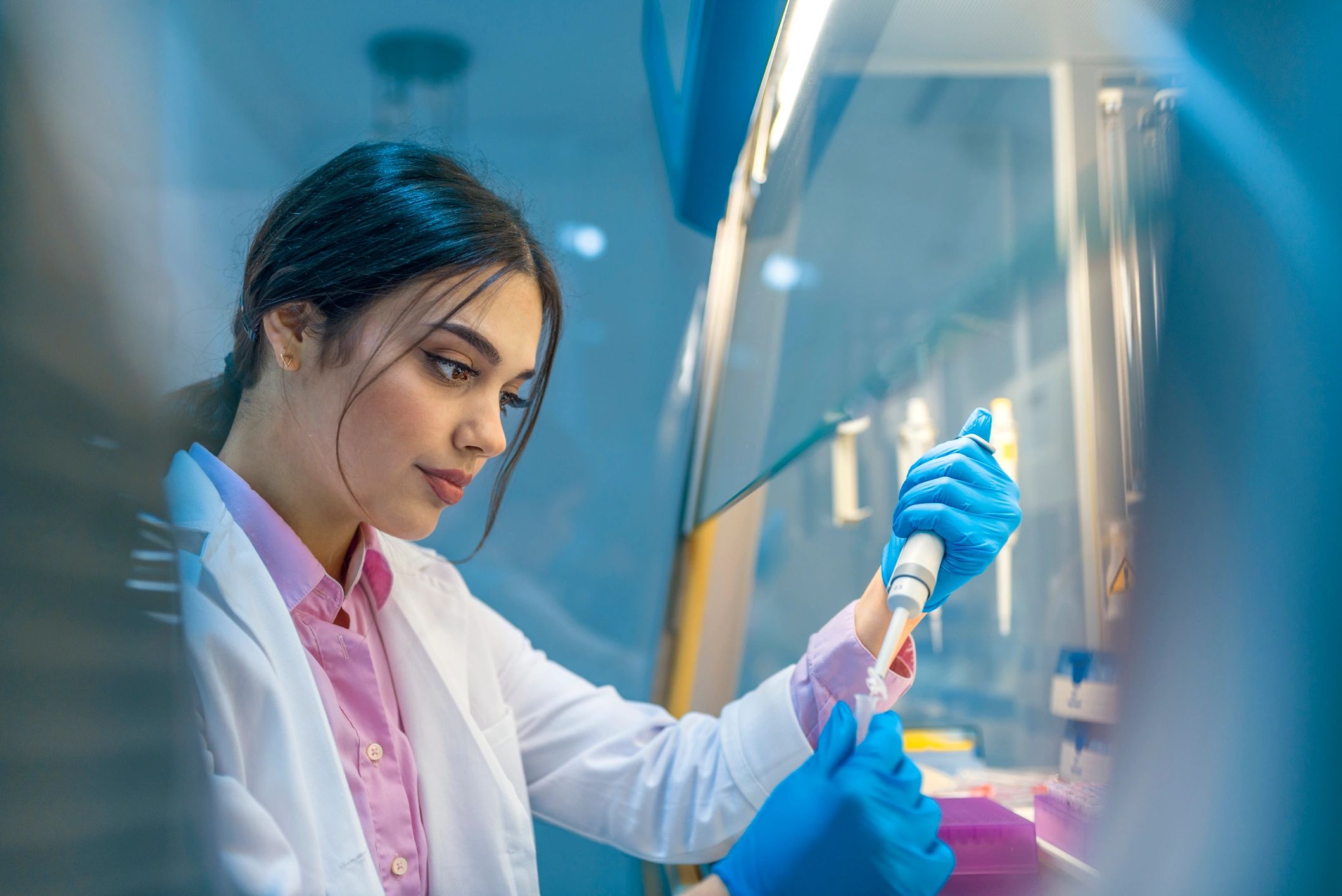 Scientist working with lab glassware during an experiment